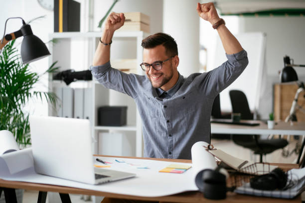 istock Happy businessman working in the office. 1292938892