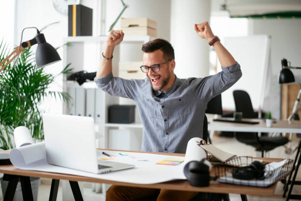 istock Happy businessman working in the office. 1292938955
