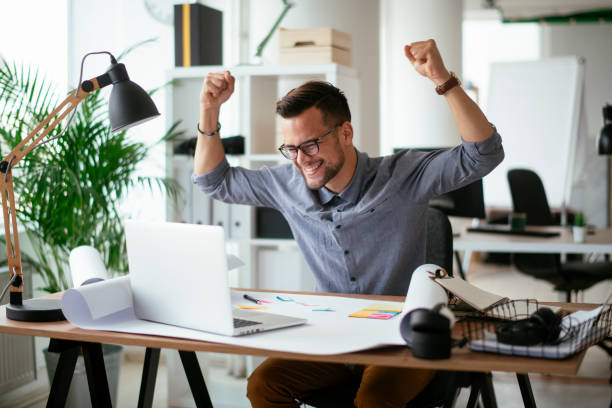 istock Happy businessman working in the office. 1292939690
