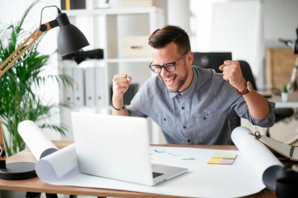 istock Happy businessman working in the office. 1292939843