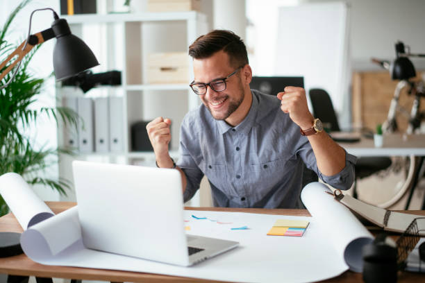 istock Happy businessman working in the office. 1292939864