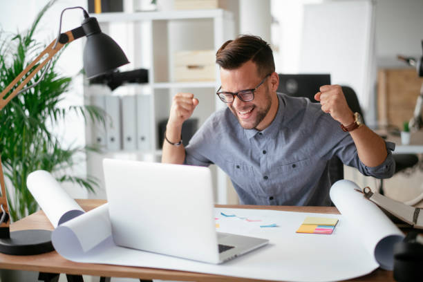 istock Happy businessman working in the office. 1292939934