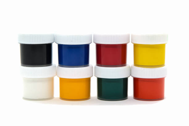 istock Closed plastic jars with gouache paint of different colors for children's creativity on white background 1292942240