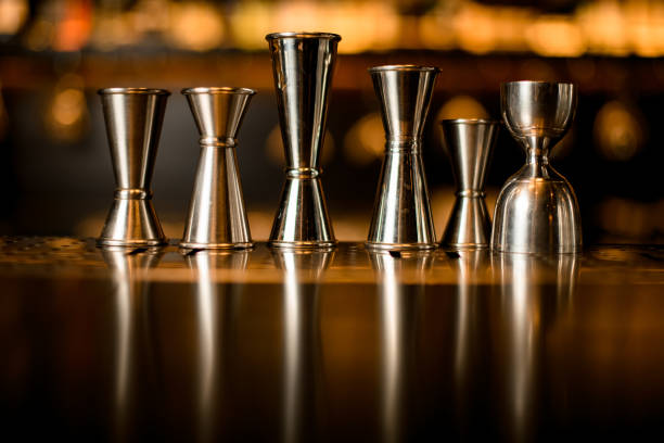 istock Many different jiggers stands in row on the bar counter 1292942613