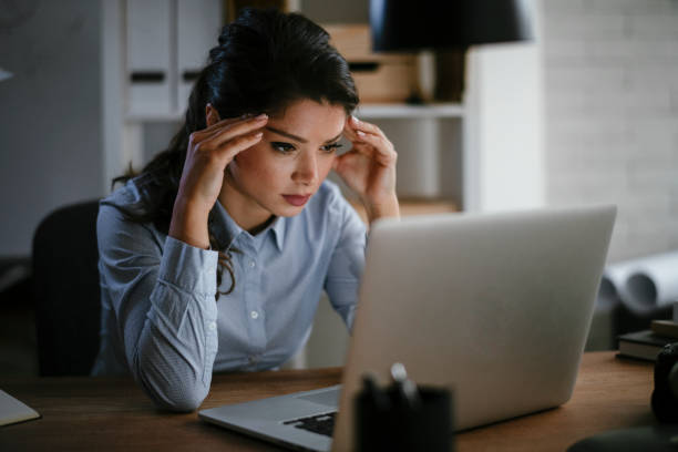 istock Tired businesswoman in office. 1292943499