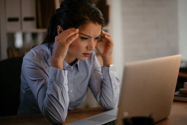 istock Tired businesswoman in office. 1292943502