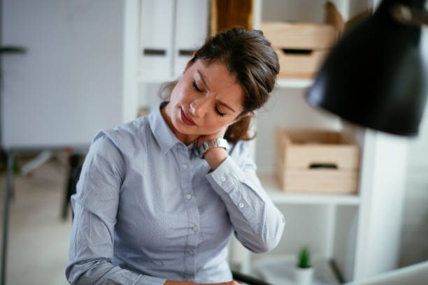 istock Tired businesswoman in office. 1292944401