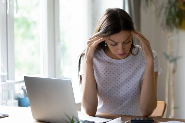 istock Close up frustrated woman checking finances, having problem with money 1292945432