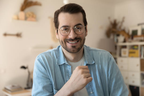 istock Head shot portrait smiling man wearing glasses making video call 1292945804