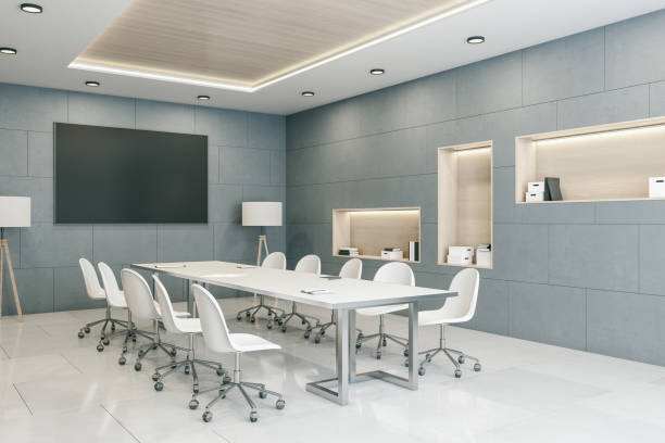 istock Minimalistic conference room with blank tv screen. 1292947889