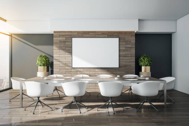 istock Minimalistic meeting room with blank poster on brick wall 1292947981
