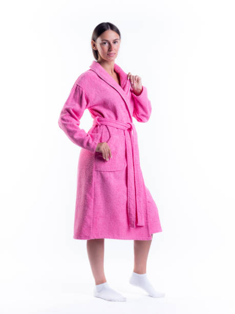 istock woman in a Bathrobe on an isolated white background with a smile on her face. 1292948763
