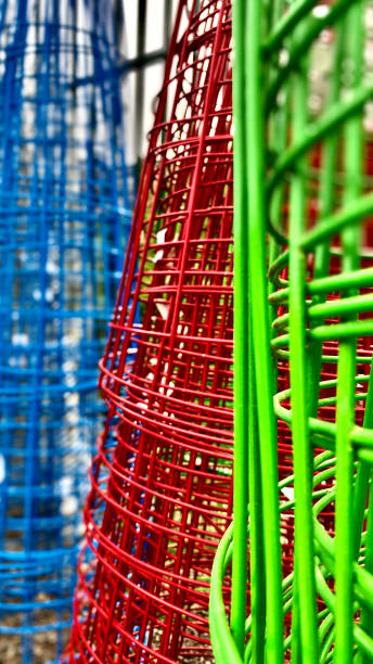 istock blue red & green tomato cages - abstract 1292948932