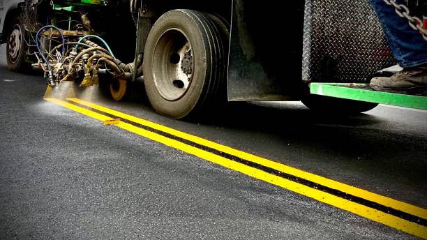 spraying the new double yellow lines