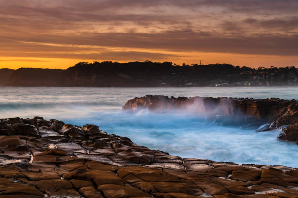 istock High Cloud Sunrise Seascape from Rock Platform 1292960006