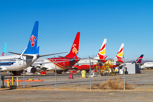 Victorville, CA, USA – December 22, 2020: Commercial airplanes are parked in the Mojave Desert at the Southern California Logistics Airport in Victorville, California.