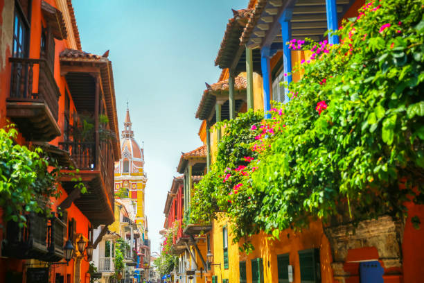 Lush balcony planters along the street looking towards town square in the old town of Cartagena Columbia stock photo