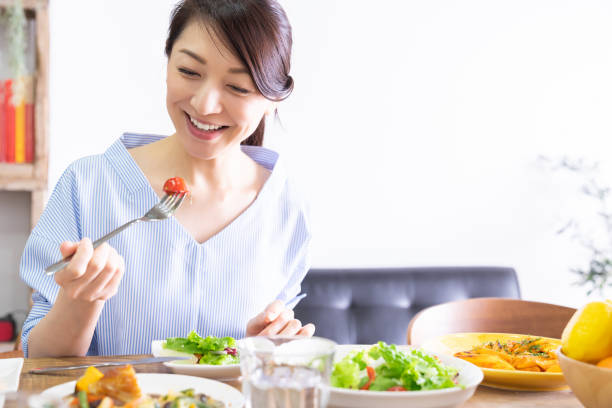 istock asian woman who eats 1292967563
