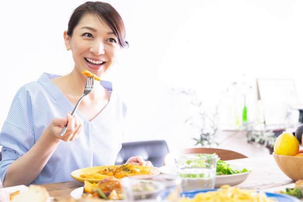 istock asian woman who eats 1292967577