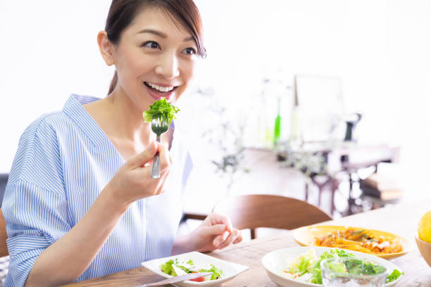 istock asian woman who eats 1292967586