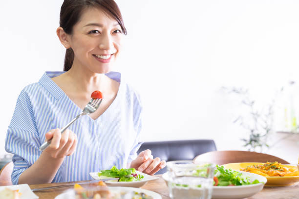 istock asian woman who eats 1292967589