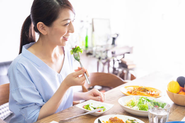 istock asian woman who eats 1292967592
