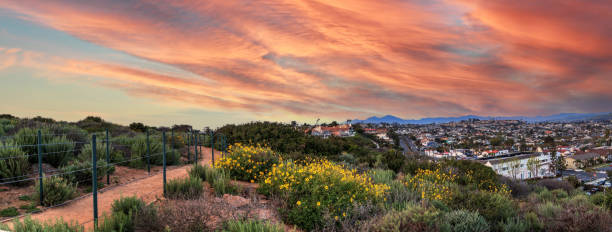 istock Hiking trail above Dana Point city view at sunset 1292969293