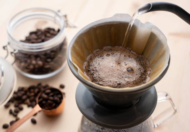 istock Pour hot water over the coffee powder.Make drip coffee. 1292971336