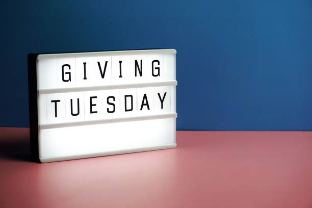 istock Giving Tuesday word in light box on blue and pink background 1292985333