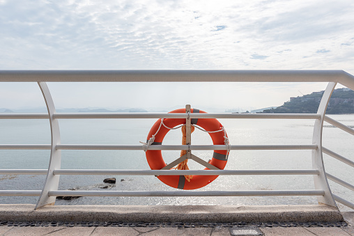 A lifebuoy on the seaside railing