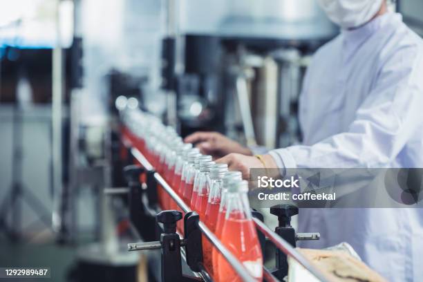 Drink Factory Closeup Hygiene Worker Working Check Juice Glass Bottled In Production Line Stock Photo - Download Image Now