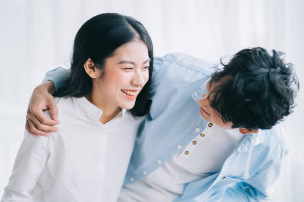 Couple, people Asian couple happily embracing each other cute couple stock pictures, royalty-free photos & images