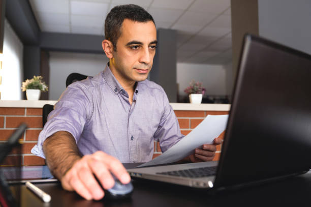 istock Man With Casual Clothing Working In Office 1292997714