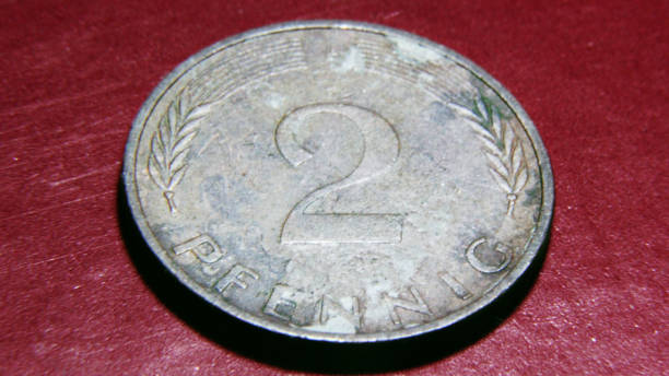 istock Collection of old metal coins from various countries ( 2 pfennig germany coin) 1292998570