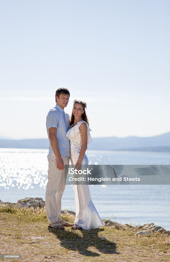 Bride and groom standing outdoors  20-24 Years Stock Photo