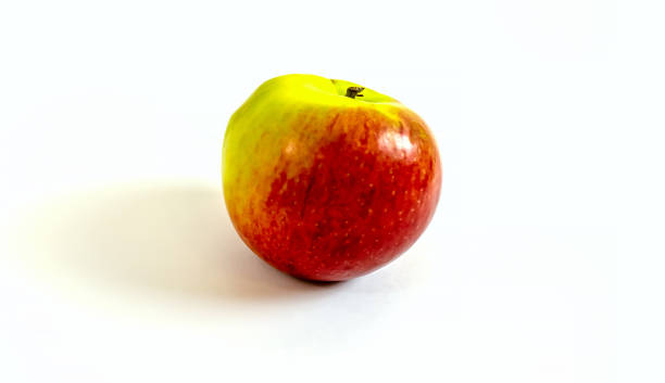 istock photo red apple on a white background close up 1293001703