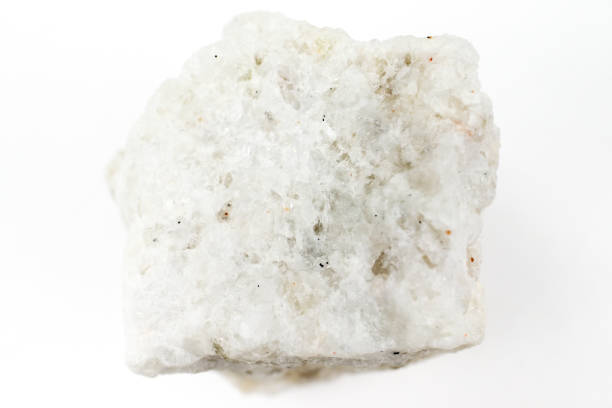 Opaque white albite Opaque white albite on white background. feldspar stock pictures, royalty-free photos & images
