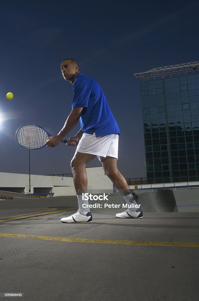 Tennis player on rooftop court  25-29 Years Stock Photo