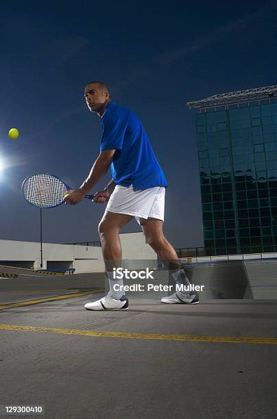 Tennis Player On Rooftop Court Stock Photo - Download Image Now - 25-29 Years, Adult, Adults Only