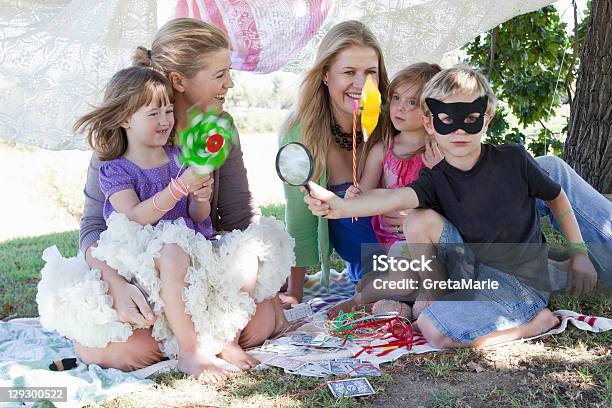Mothers And Children Playing In Backyard Stock Photo - Download Image Now - Pinwheel Toy, 2-3 Years, 30-34 Years