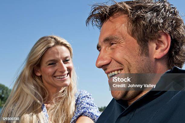 Couple Laughing Together Outdoors Stock Photo - Download Image Now - 30-34 Years, 30-39 Years, Adult