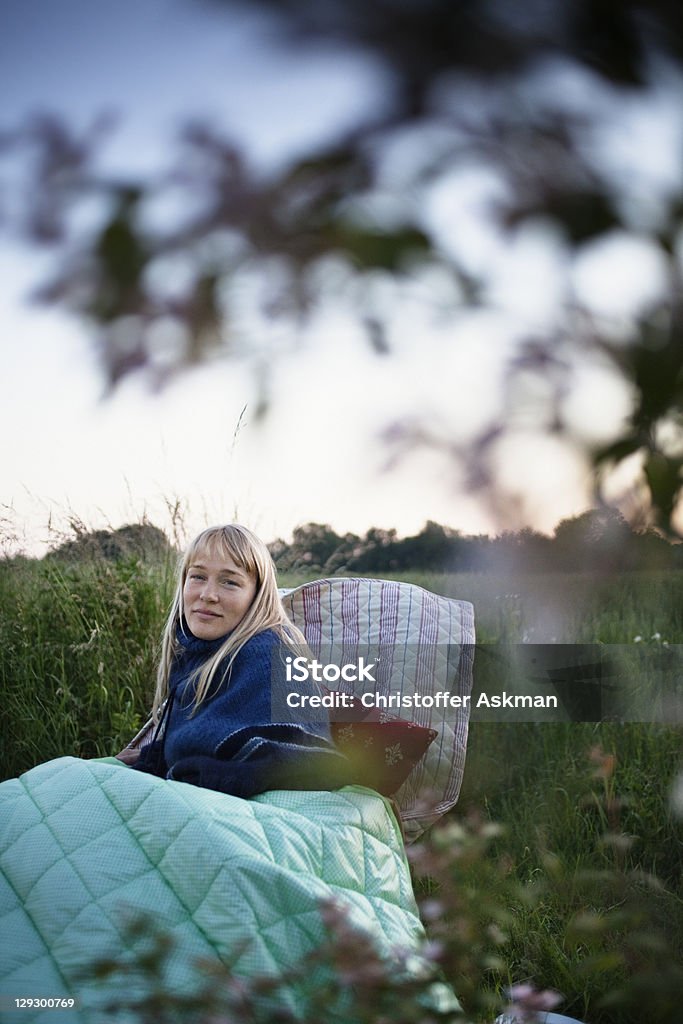 Woman wrapped in blankets outdoors  30-39 Years Stock Photo