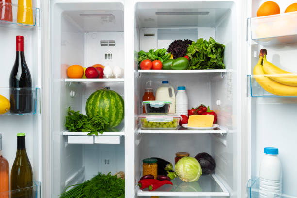 istock Open fridge full of fruits, vegetables and drinks 1293008059