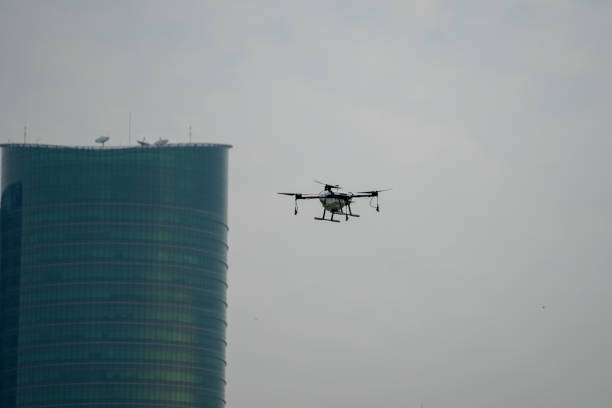 istock Industrial Drone Flying in town with building in background 1293008111