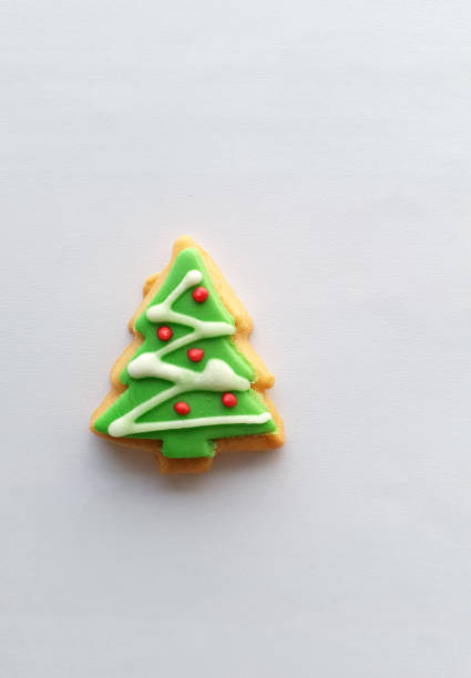 istock Christmas tree decoration on butter cookies on white background 1293008237