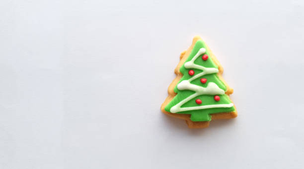 istock Christmas tree decoration on butter cookies on white background 1293008238