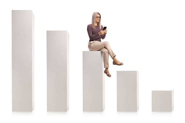 istock Smiling young woman using a smartphone and sitting on white column 1293009580