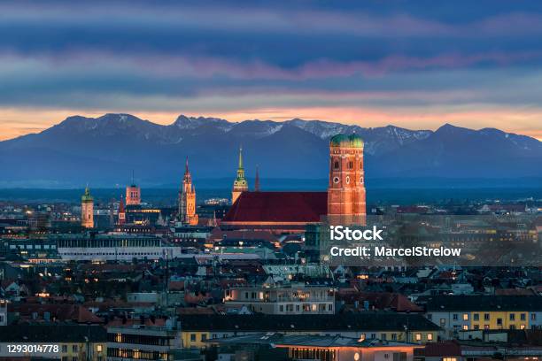 Munich At Dusk Mountains Of German Alps Behind Frauenkirche Stock Photo - Download Image Now