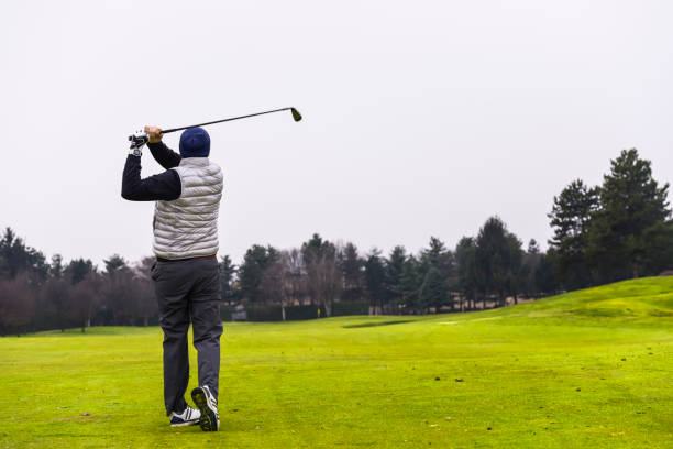 istock Close up Golfer is driving golf ball to green course 1293015605