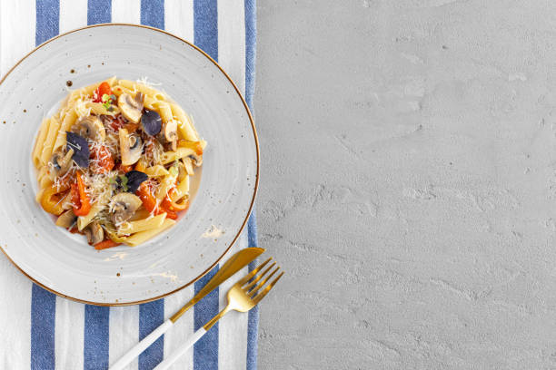 istock Pasta with mushrooms and cream sauce served on plate 1293016509